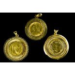 Set of three pendants set with coins 18 kt gold pendants and one-nine-fine or 22 kt gold coins.