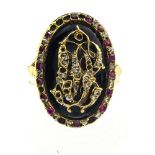 Mourning ring 18 kt yellow gold, set with interspersed rubies and diamonds forming the letters C and