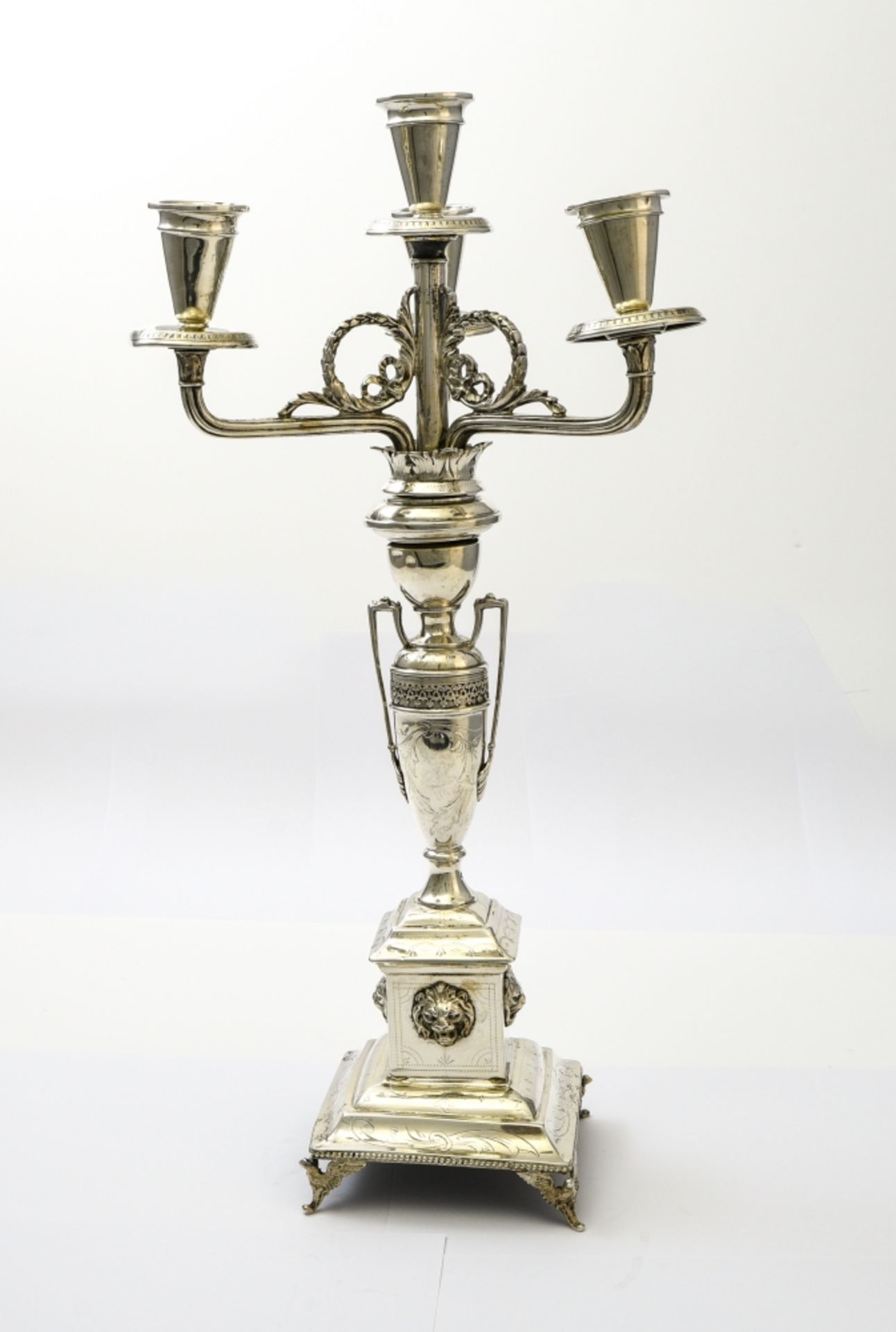 Candelabra VIENNA, SECOND HALF OF THE 19TH CENTURY Silver, with a shaft depicting an amphora vase,