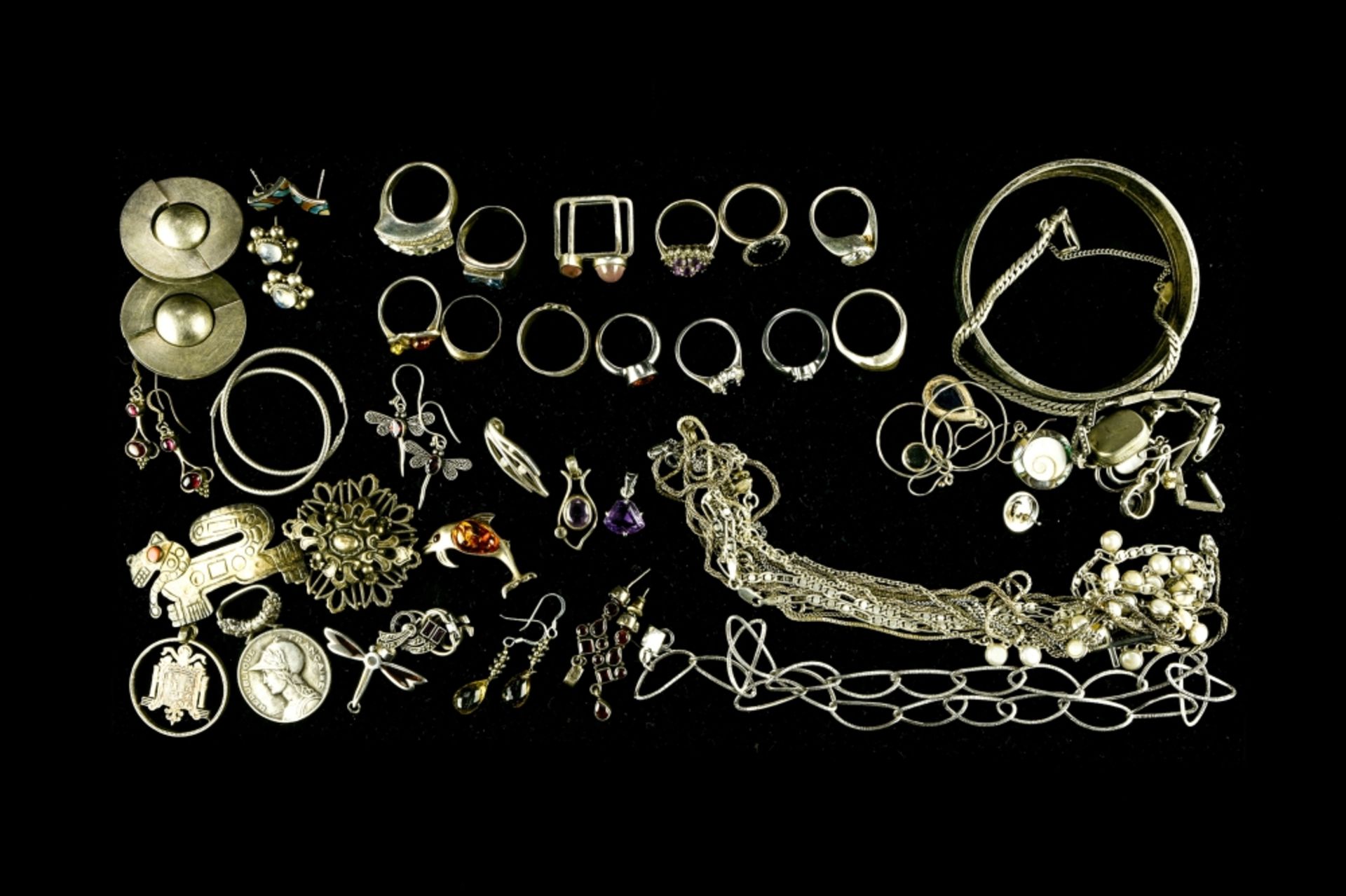 Large lot of silver jewellery Includes two bracelets, thirteen rings, three brooches, eight