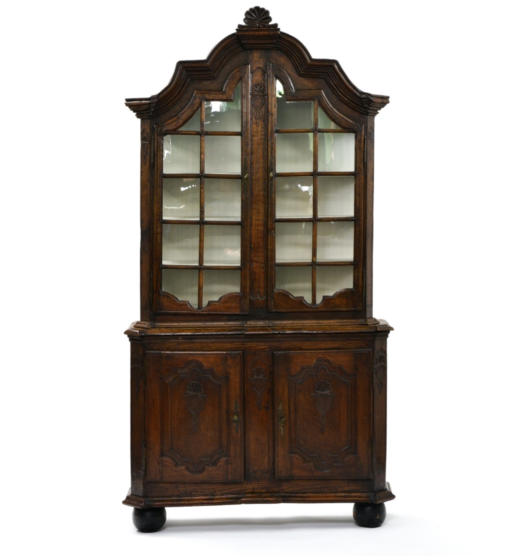 Double-bodied secretary LIEGE, 18TH CENTURY Carved and moulded oak, composed of an upper display