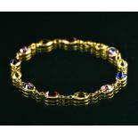 Multicolour bracelet 18 kt yellow gold, set with twelve coloured stones (peridot, amethyst, etc.).