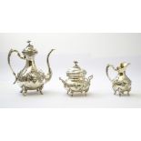 WOLFERS Frres Tea set Composed of a teapot, a creamer, and a sugar bowl, with floral dŽcor.