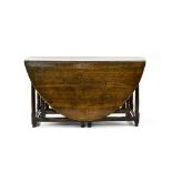 Gateleg table EARLY 18TH CENTURY ENGLISH WORK oak wood, oval-shaped with baluster base H : 74 cm