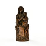 Seated Madonna and Child 19TH CENTURY, MEDIEVAL STYLE Ronde-bosse carved oak. Seated on a throne