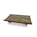 Coffee table INDONESIA composed of two antique sections of finely carved polychrome wood, inlaid