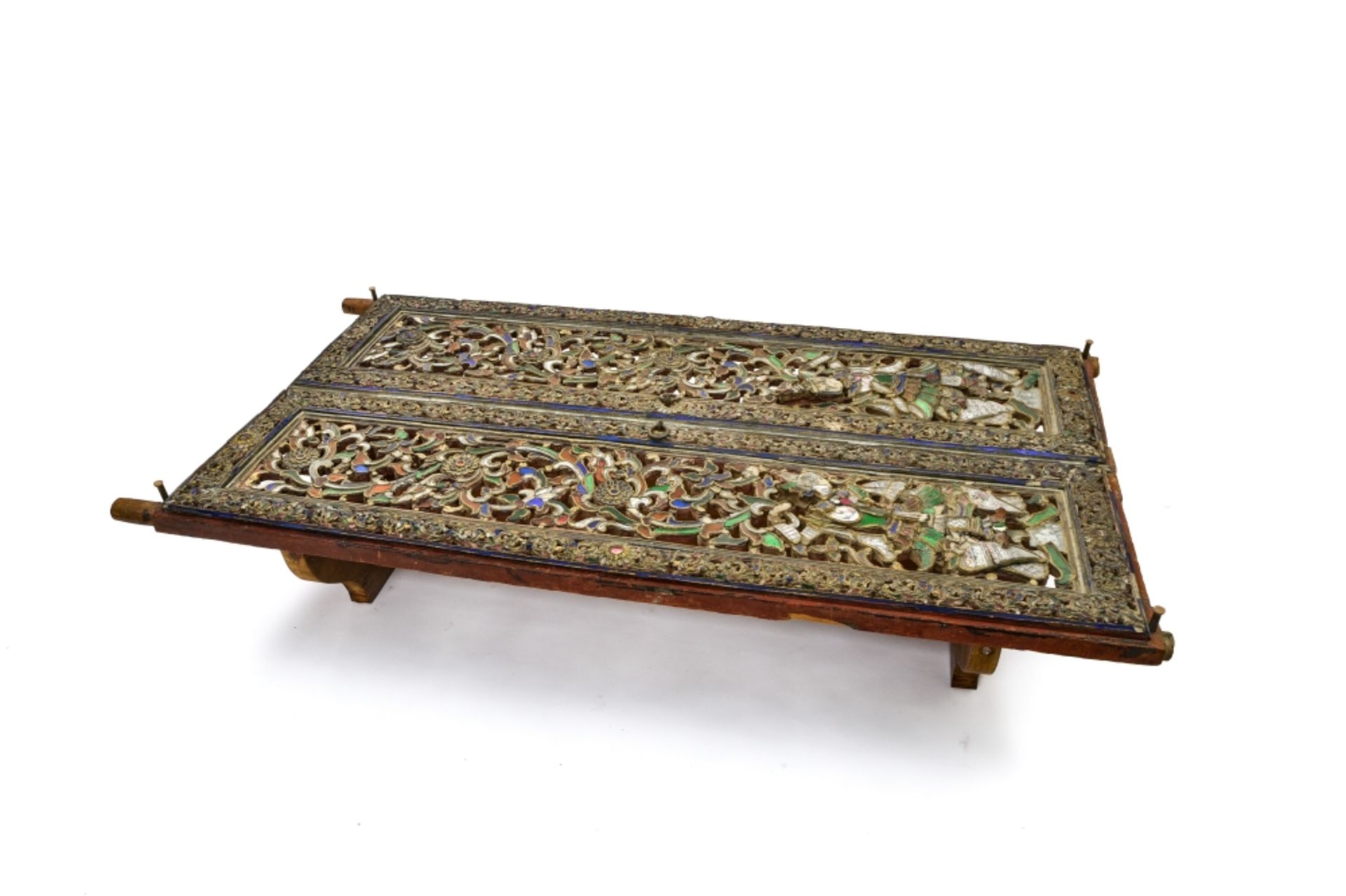 Coffee table INDONESIA composed of two antique sections of finely carved polychrome wood, inlaid