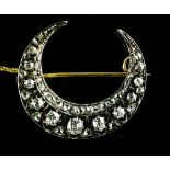 Crescent moon brooch White gold on 18 kt rose gold, set with eleven antique-cut diamonds, with an
