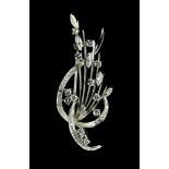Sheaf brooch 18 kt white gold, set with twelve brilliant-cut diamonds with a total weight of approx.