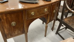 19th cent. Mahogany bow front sideboard, fitted central drawer flanked by a pair of panel doors on