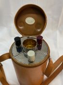 20th cent. Tan leather triple spirit flask with four cups. Retailers label Cummings of Exeter with