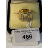 Jewellery: Yellow metal tapering ring with split head set with forty two brilliant cut diamonds,