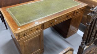 19th cent. Mahogany double pedestal desk, two short and one long drawer, above two cupboards with