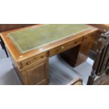 19th cent. Mahogany double pedestal desk, two short and one long drawer, above two cupboards with