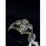 Jewellery: Diamond four stone ring. Four old brilliant cut diamonds, individually collar set in a