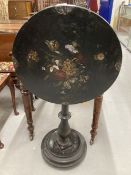 19th cent. Pontypool style black ground papier mache tilt top occasional table with gun barrel