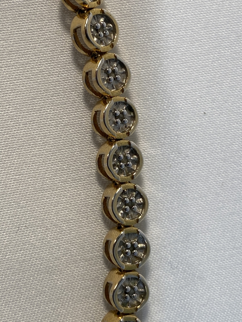 Jewellery: Yellow metal bracelet with disc links, each set with a single diamond, twenty eight in - Image 2 of 2