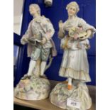 Late 19th early 20th cent. German figurines, man and woman picking flowers, multicoloured