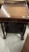 19th cent. Rosewood davenport Gothic style gallery back, lift top writing compartment, satinwood