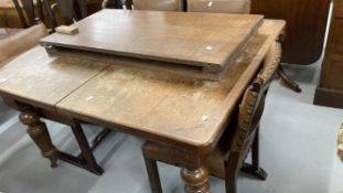 19th cent. Oak extending dining table with two leaves, on turned supports. Width 42ins. Length