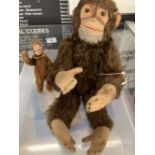 Toys: Mid 20th cent. Brown plush monkey with felt face, hands and feet, height 10ins. Plus miniature
