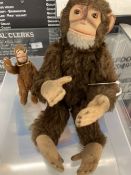 Toys: Mid 20th cent. Brown plush monkey with felt face, hands and feet, height 10ins. Plus miniature