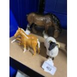 20th cent. Ceramics: Beswick Palamino foals, one standing, one laying, black face sheep, and shire