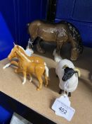 20th cent. Ceramics: Beswick Palamino foals, one standing, one laying, black face sheep, and shire