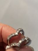 Jewellery: Two individual diamond seven stone wishbone rings. Each ring set with seven round