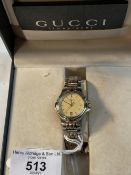 Watches: Gold plated and stainless steel ladies Gucci bracelet wrist watch champagne coloured