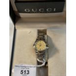 Watches: Gold plated and stainless steel ladies Gucci bracelet wrist watch champagne coloured