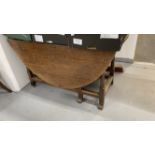 18th/19th cent. Oak drop leaf, gate leg dining table with later additions, on gun barrel supports