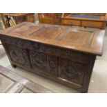 18th cent. oak coffer with carved decoration to front, the top opening in two sections. 52ins. x