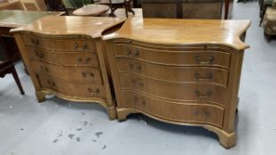20th cent. Satinwood veneered serpentine chest of graduated four drawers and brushing slide.