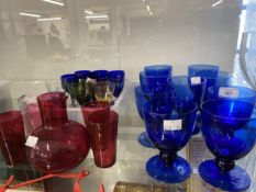 19th/20th cent. Drinking Glasses: Cranberry tumblers x 4 and a twist handled jug, Harlequin coloured