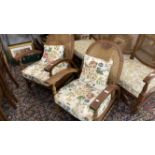 Art deco, a pair of Dutch oak Bergere armchairs on turned supports.