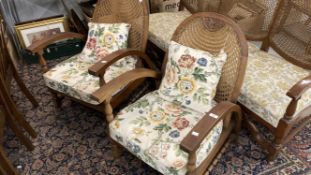 Art deco, a pair of Dutch oak Bergere armchairs on turned supports.