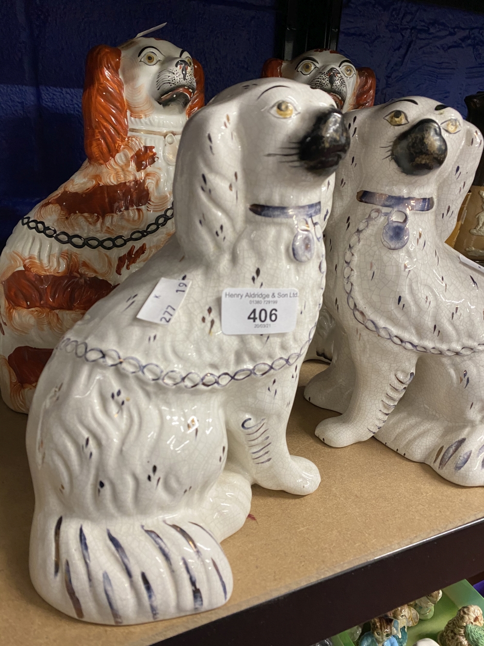 19th cent. Staffordshire comfort dogs, liver and white, a pair. Plus white and lustre flecked, a