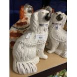 19th cent. Staffordshire comfort dogs, liver and white, a pair. Plus white and lustre flecked, a
