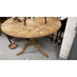 19th cent. Pine tilt top table on pedestal support with tripod feet.