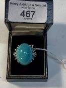 Jewellery: White metal ring set with an oval turquoise 25mm x 20mm and thirty brilliant cut