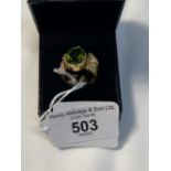 Hallmarked Gold: 18ct yellow gold ring set with an oval peridot, estimated weight 5.50ct, with a