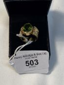 Hallmarked Gold: 18ct yellow gold ring set with an oval peridot, estimated weight 5.50ct, with a