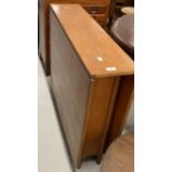 store 1970s teak drop leaf table, retailed by McIntosh. 59ins. x 36ins extended. 8½ins. x 36ins