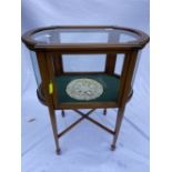 Edwardian mahogany Bijouterie table of oval form, satinwood inlaid glass top and side panels of