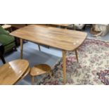 1960s Ercol style teak and beech dining table on tapering supports. 54ins. x 27ins. x 28ins.