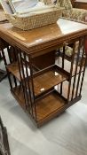 19th cent. Oak revolving bookcase with tray top. 21ins. x 21ins. x 32ins.