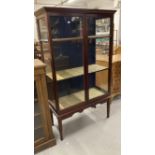 19th cent. Mahogany glazed bookcase on stand, fully glazed on tapering supports. 38ins. x 17ins. x