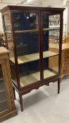 19th cent. Mahogany glazed bookcase on stand, fully glazed on tapering supports. 38ins. x 17ins. x