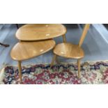 1960s Ercol teak and beech 'Pebble' nest of three tables, with makers trademark. 25ins. x 17ins.